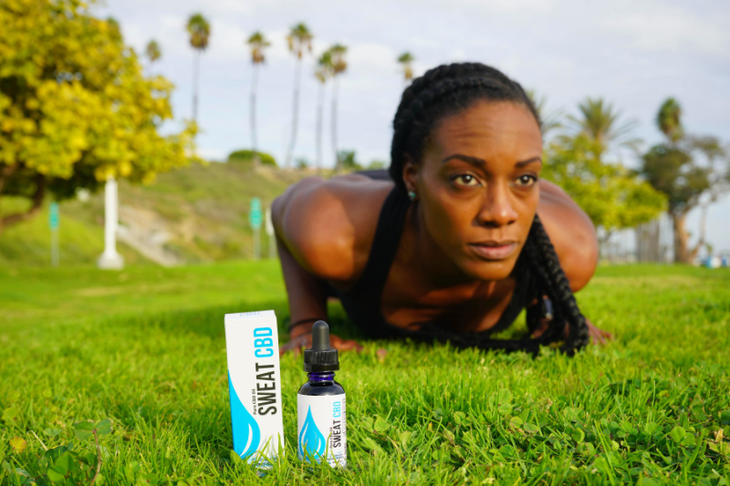 woman exercising with cbd workout supplements